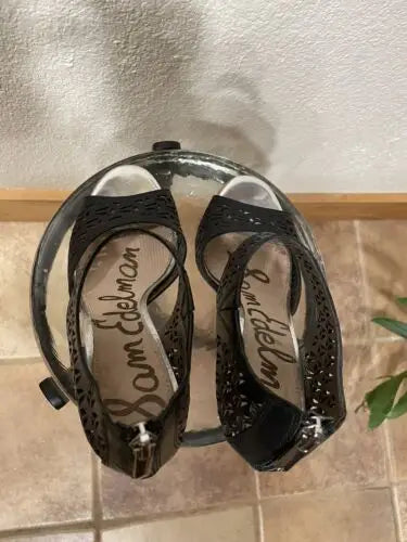 Black Sam Edelman high heels with peep toe design, perfect for stylish women’s footwear