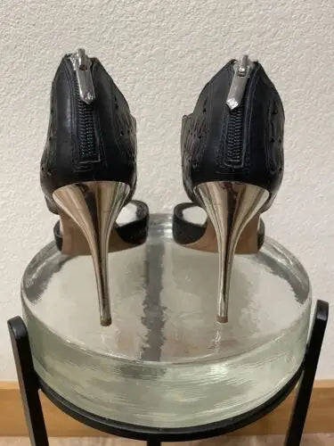 Black Sam Edelman high heels with silver metallic heels and back zippers for women