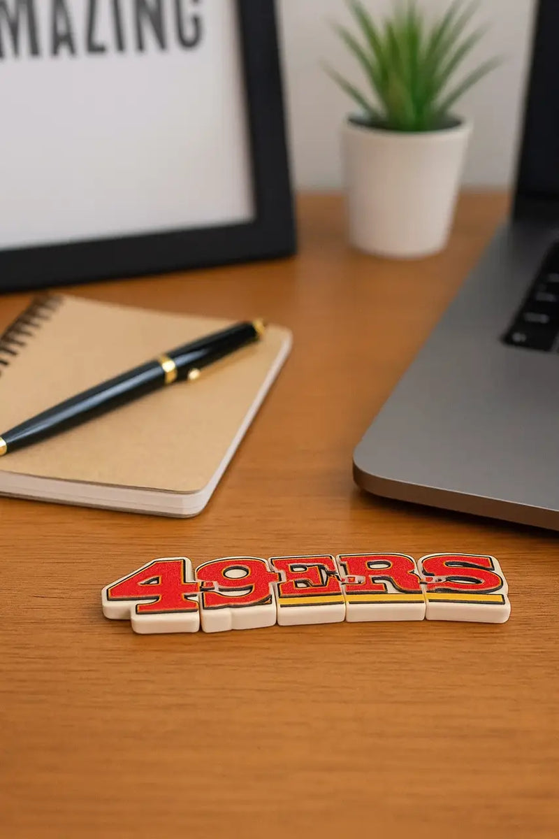 San Francisco 49ers letter magnets on the San Francisco 49ers Flexi Logo Sign desk toy