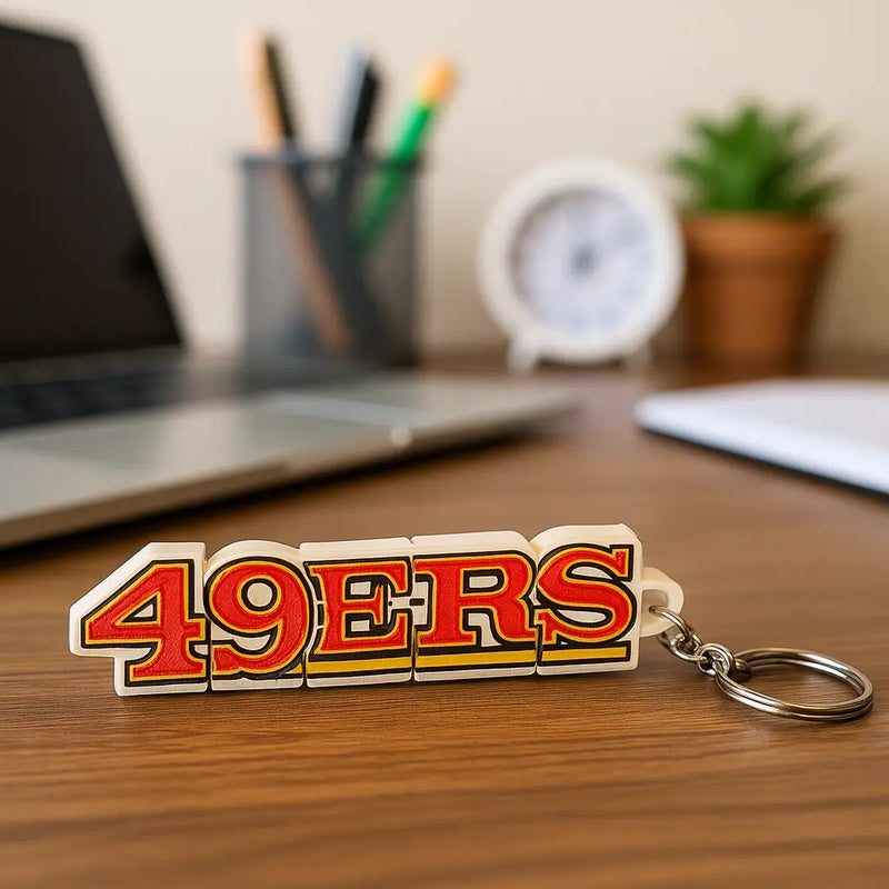 White and red san francisco 49ers keychain with yellow outline, NFL football fan gift