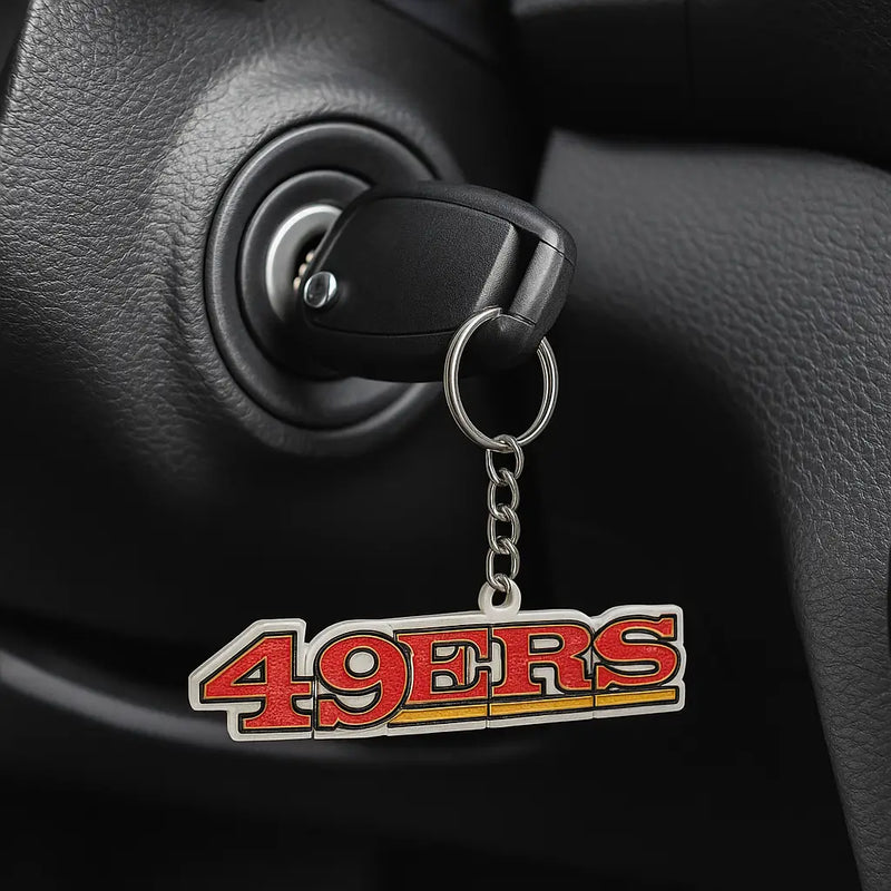 Black car key in ignition with san francisco 49ers keychain NFL football fan gift