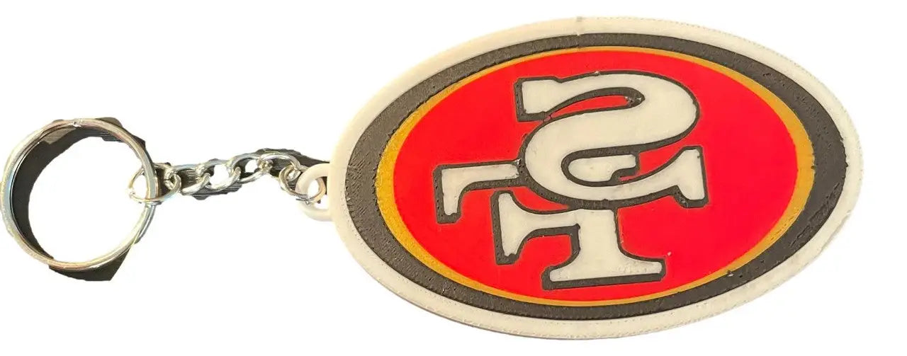 San Francisco 49ers oval logo keychain with red and gold design, perfect fan gift