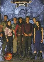 Group of people in casual clothing holding a Serenity SP-1 promo card for trading cards