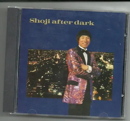 Shoji After Dark Music CD like-new with man in sequined jacket against cityscape
