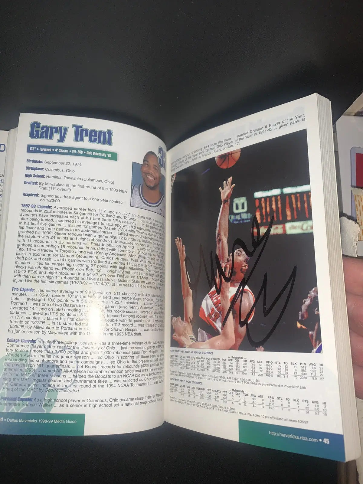 Autographed page from Dallas Mavericks Media Guide featuring Dirk Nowitzki and Steve Nash