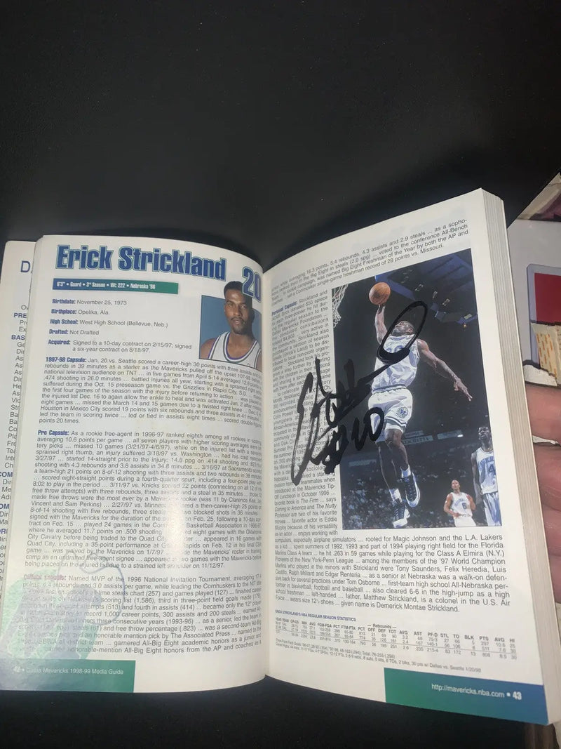 Autographed Erick Strickland page from Dallas Mavericks media guide book