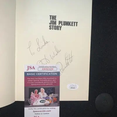 Signed Jim Plunkett biography with authentication showcasing the Jim Plunkett story HC Auto JSA