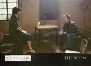 Two people conversing, featured on Six Feet Under promo card for trading cards