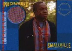 Trading card of a character in a red shirt from Smallville Season 3 Pieceworks Costume Card