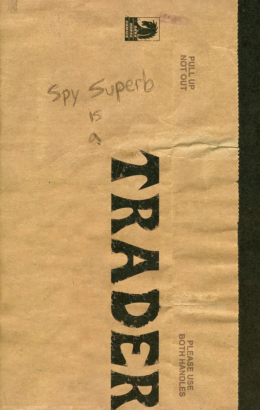 Torn brown paper bag with TRADER text hinting at Spy Superb trading cards
