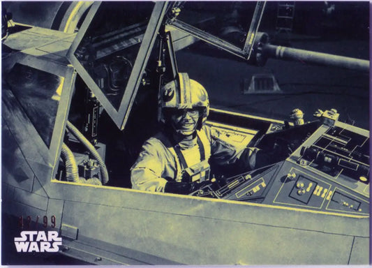 Pilot in yellow flight suit in spacecraft cockpit for Star Wars trading cards