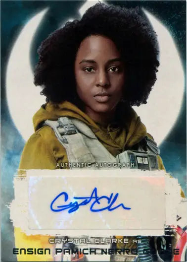 Portrait of Crystal Clarke as Pamich Nerro Goode in a yellow jacket under a crescent moon