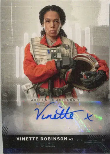 Autographed trading card of Vinette Robinson as Tyce in an orange flight suit
