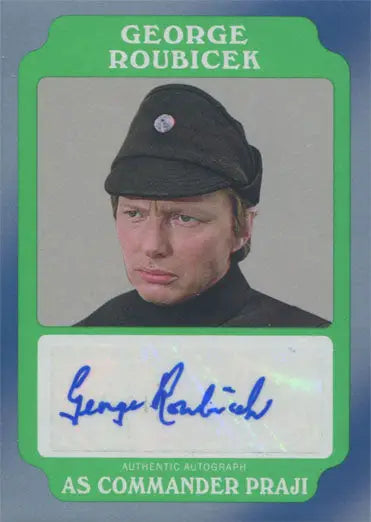 Autograph card of George Roubicek in a dark uniform cap with a green border