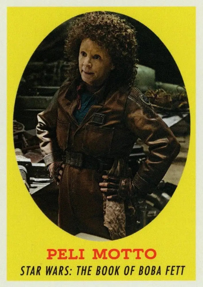 Trading card of Star Wars character Peli Motto in a brown coat and curly hair