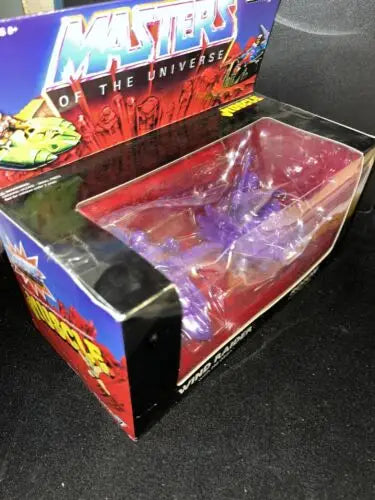 Super 7 Masters of the Universe Wind Raider toy packaging with trading cards and He-Man design