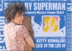 Costume card of Kitty Kowalski in floral print top from Superman Returns trading cards