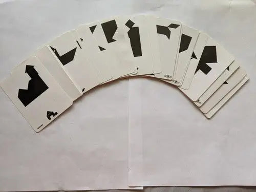Fanned deck of abstract Chinese puzzles from Tangram 1600 Ancient Chinese Puzzles by Michael Schuyt