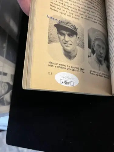 Open book showcasing baseball player photos and Ted Lyons trading cards for collectors