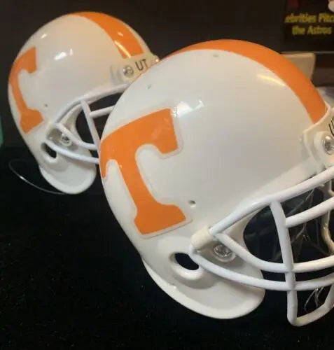 Two white Tennessee Volunteers football helmet hoods as hood ornaments by Hard Headed Sports