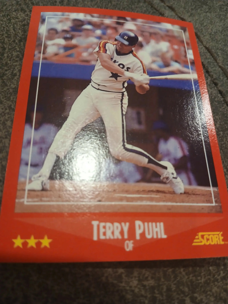 Red-bordered baseball card of Terry Puhl from the White Sox at bat, trading cards