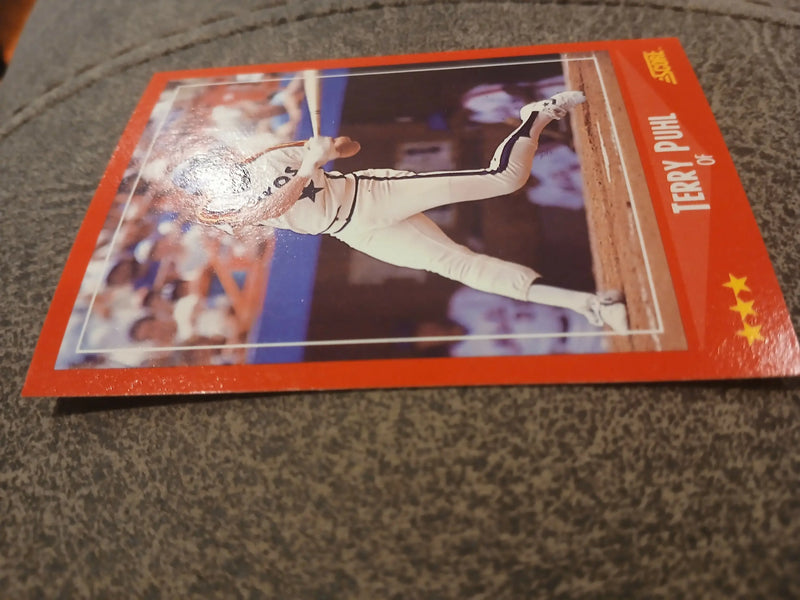 Red-bordered Terry Puhl #282 baseball card featuring a pitcher in mid-delivery