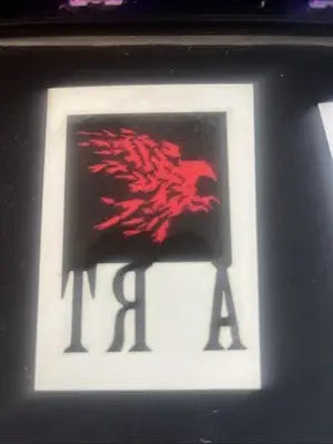 Framed art piece with a red bird from The Crow City Of Angels Temporary Tattoo collection