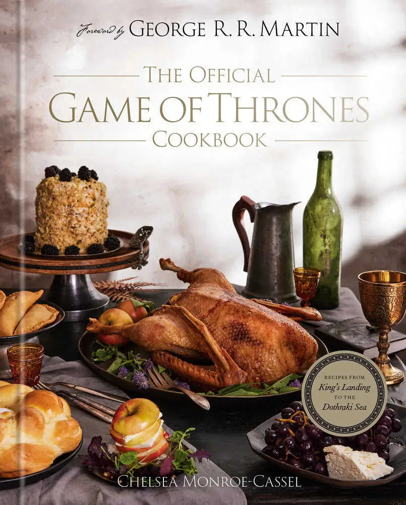 Book cover of The Official Game of Thrones Cookbook featuring a medieval feast spread