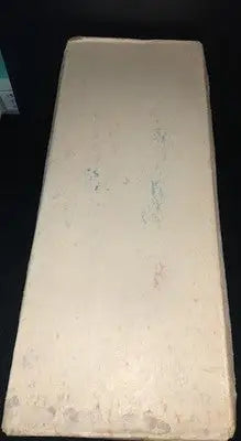 Cream-colored solid block with wear, related to Dorsett Converse football shoes in box