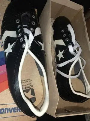 Black and white Dorsett Converse football shoes for adults and kids in Dallas Cowboys box