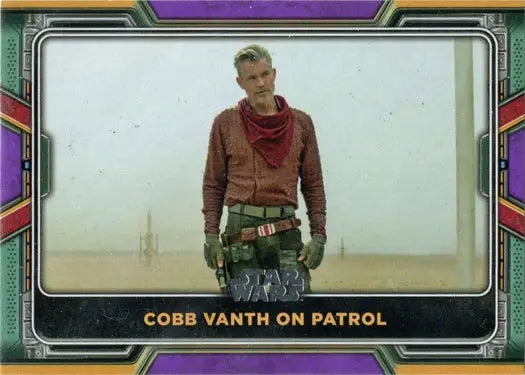 Trading card of Cobb Vanth on patrol in a brown jacket, Topps 2022 Purple Parallel