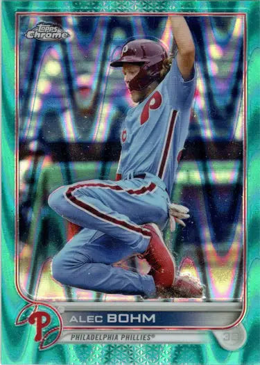 Aqua wave parallel card of Phillies player Alec Bohm sliding into base