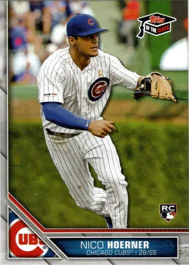 Baseball player in Chicago Cubs uniform fielding a ground ball for Topps baseball card