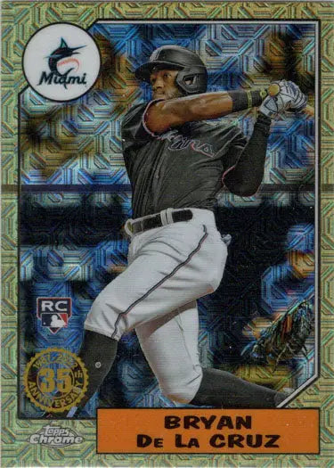 Chrome silver card featuring Miami Marlins player Bryan De La Cruz mid-swing