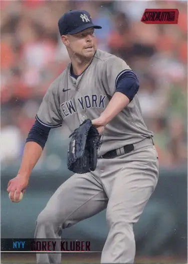 Corey Kluber mid-pitch in New York Yankees uniform on Topps Stadium Club red foil parallel card