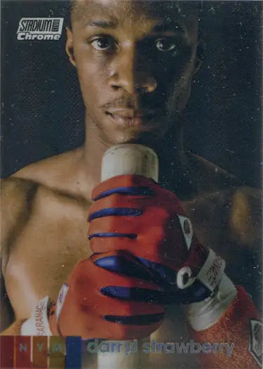 Close-up of a shirtless boxer with red gloves featured in baseball trading cards