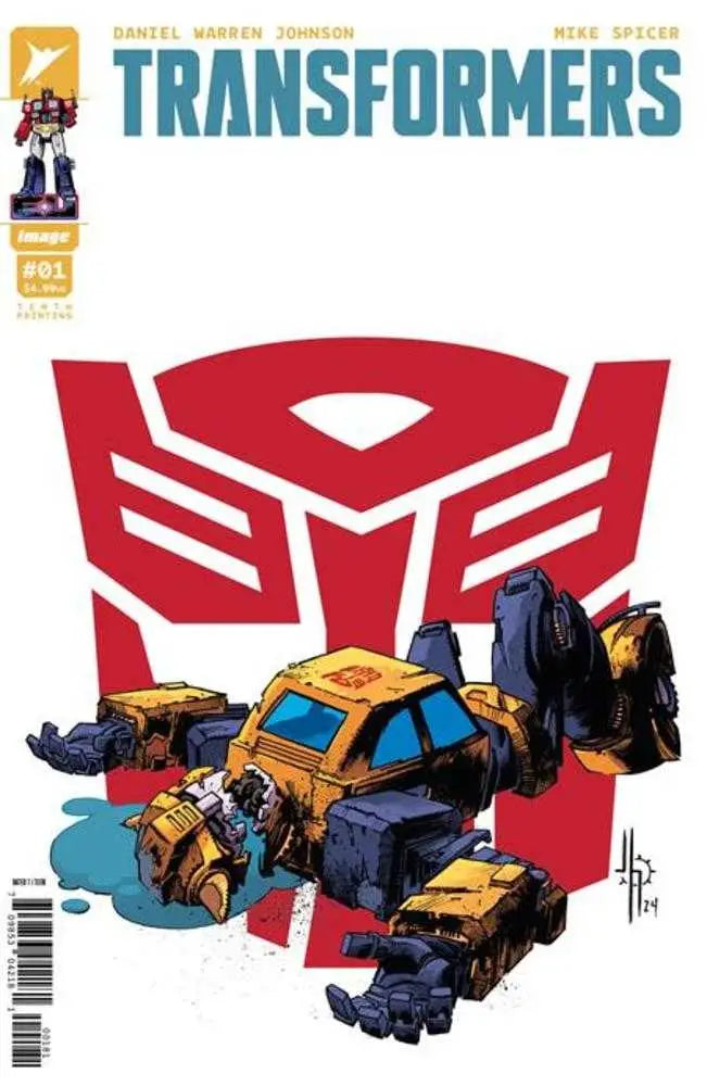 Comic book cover featuring red Autobot symbol and damaged yellow vehicle from Transformers