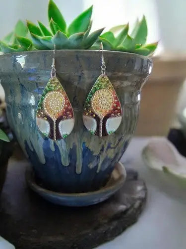 Pair of Tree of Wisdom double-sided wooden earrings with colorful bead tree design and golden sun