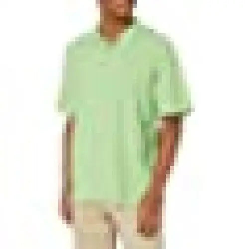 Ultraclubs men’s ULTC-8540-Whisper pique polo in light green worn by a person