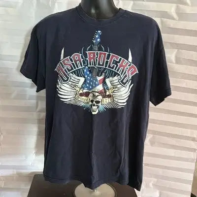 Navy blue short sleeve graphic T-shirt with skull, wings, and American flag design