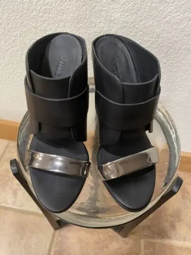 Black leather and silver heeled sandals for edgy sophistication in high heel wedge shoes