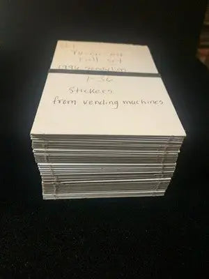 Stack of holographic vintage Yu-Gi-Oh stickers from the 1996 Sandy Lion vending set