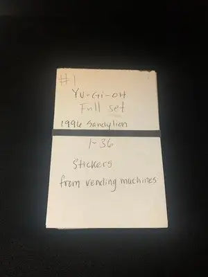 Handwritten note about Yu-Gi-Oh stickers from Vintage 1996 Yu-Gi-Oh Vending Sandy Lion set