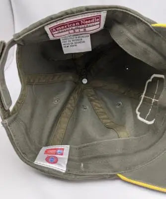 Interior of olive green vtg american needle Oregon Ducks cap with yellow trim logo