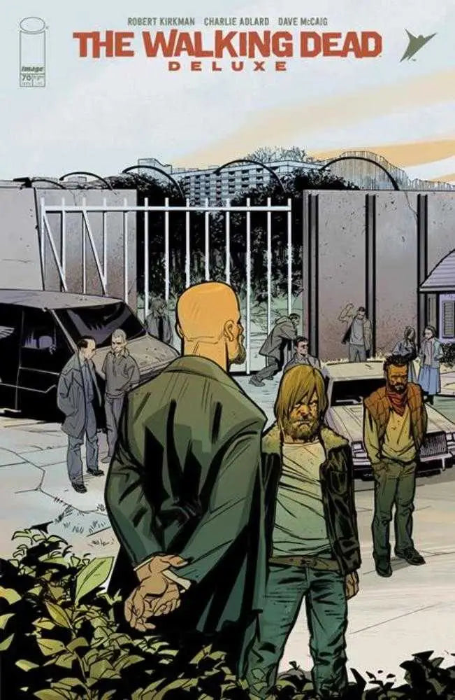 Comic book cover of The Walking Dead Deluxe #70 featuring characters outside a gated facility