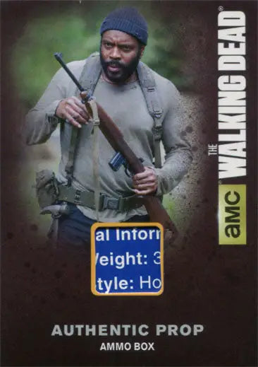 Man in outdoor gear with rifle and backpack featured on Walking Dead prop card ammo box