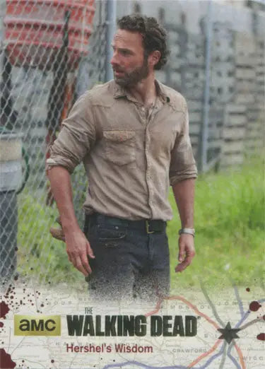 Bearded man in a tan shirt outdoors on The Walking Dead gold foil parallel card