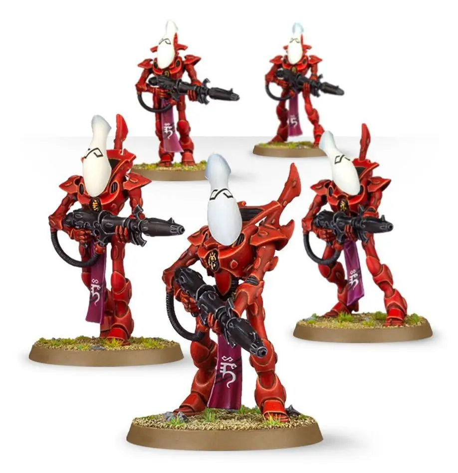 Red armored Aeldari Wraithguard miniature figurines with white helmets for Warhammer game