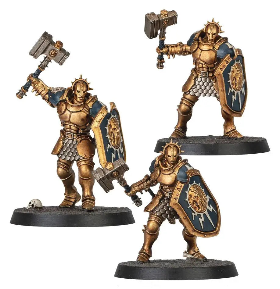 Three Stormcast Eternals miniatures with hammers and shields showcasing Citadel Colour paints