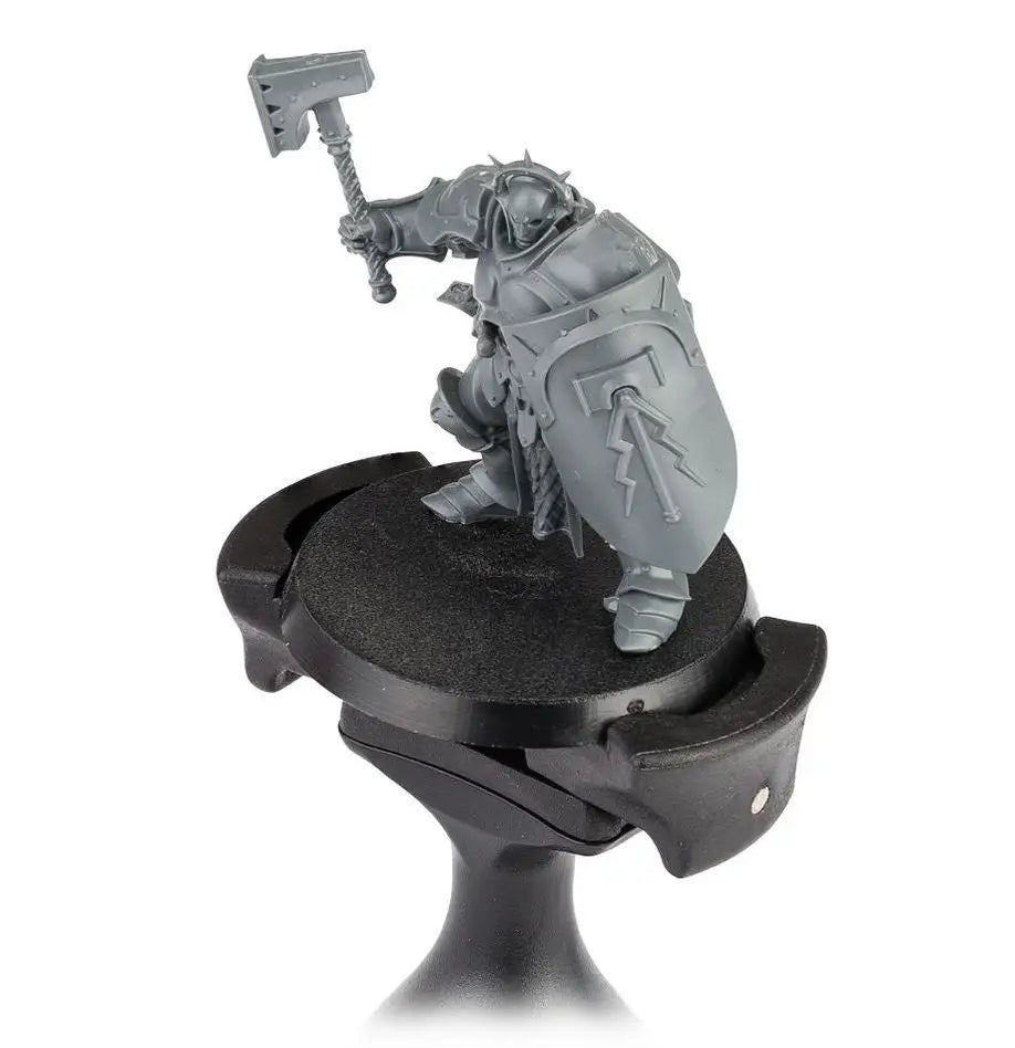 Gray plastic miniature warrior with hammer and shield for Citadel Colour Painting Handle